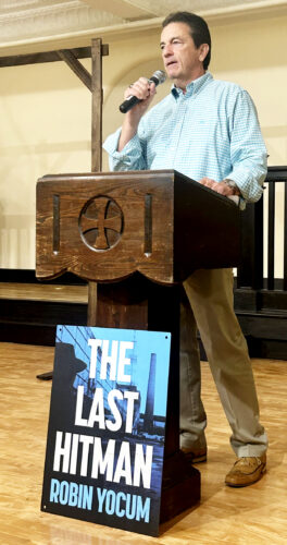 Robin Yocum entertains crowd at On the Same Page luncheon